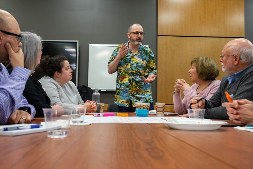 Mike of Hacking Health St. John's chairing a table conversation