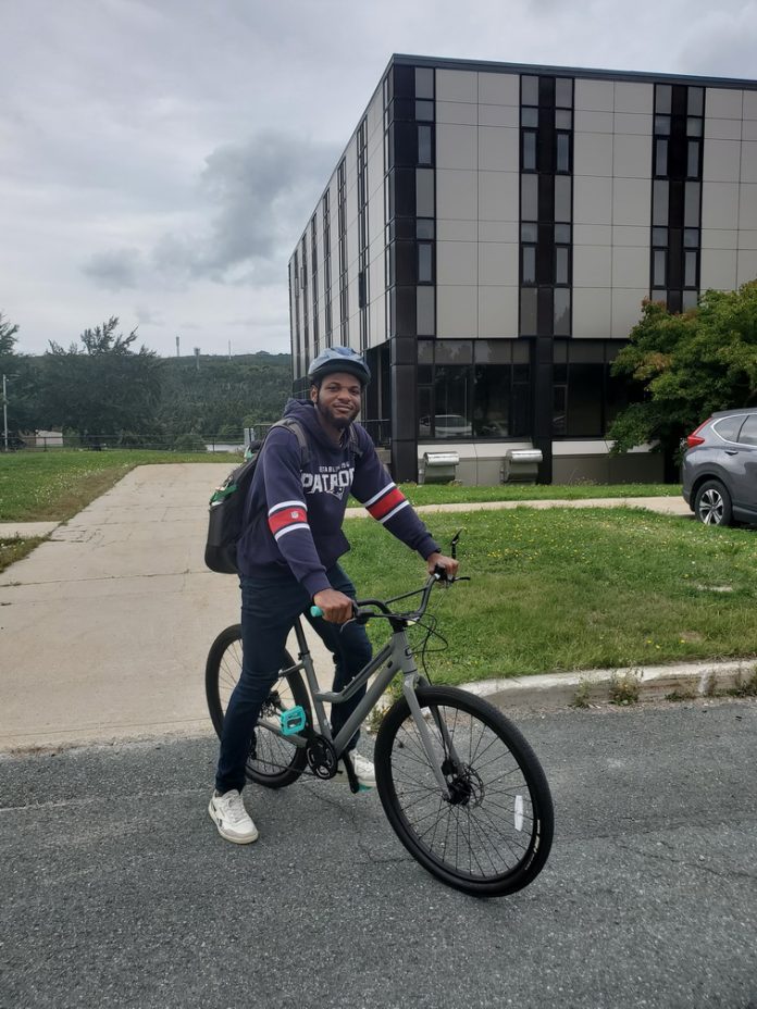 Cyclist at Queen's College, MUN. (Photo by Otis Crandell)