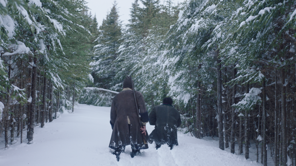 Terrance and Baji wading through the forest in ATA